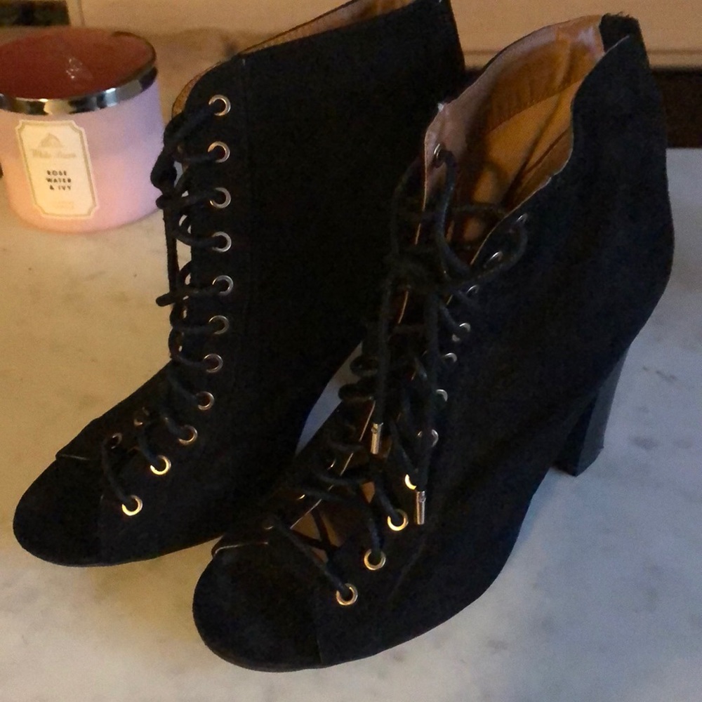 Black and gold lace-up heels